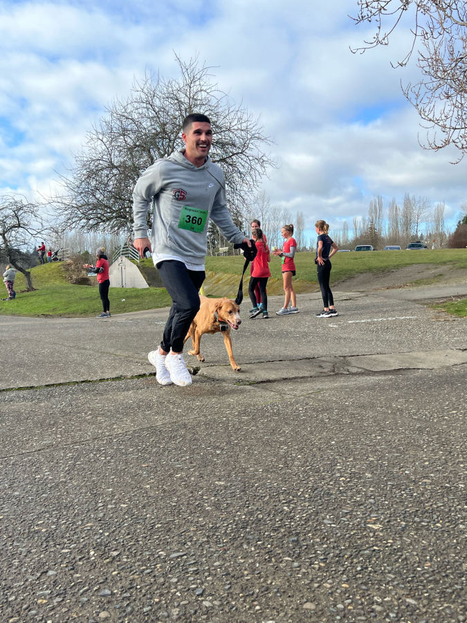 Trainer Corey running the Magnuson Series 5k with his dog Copper